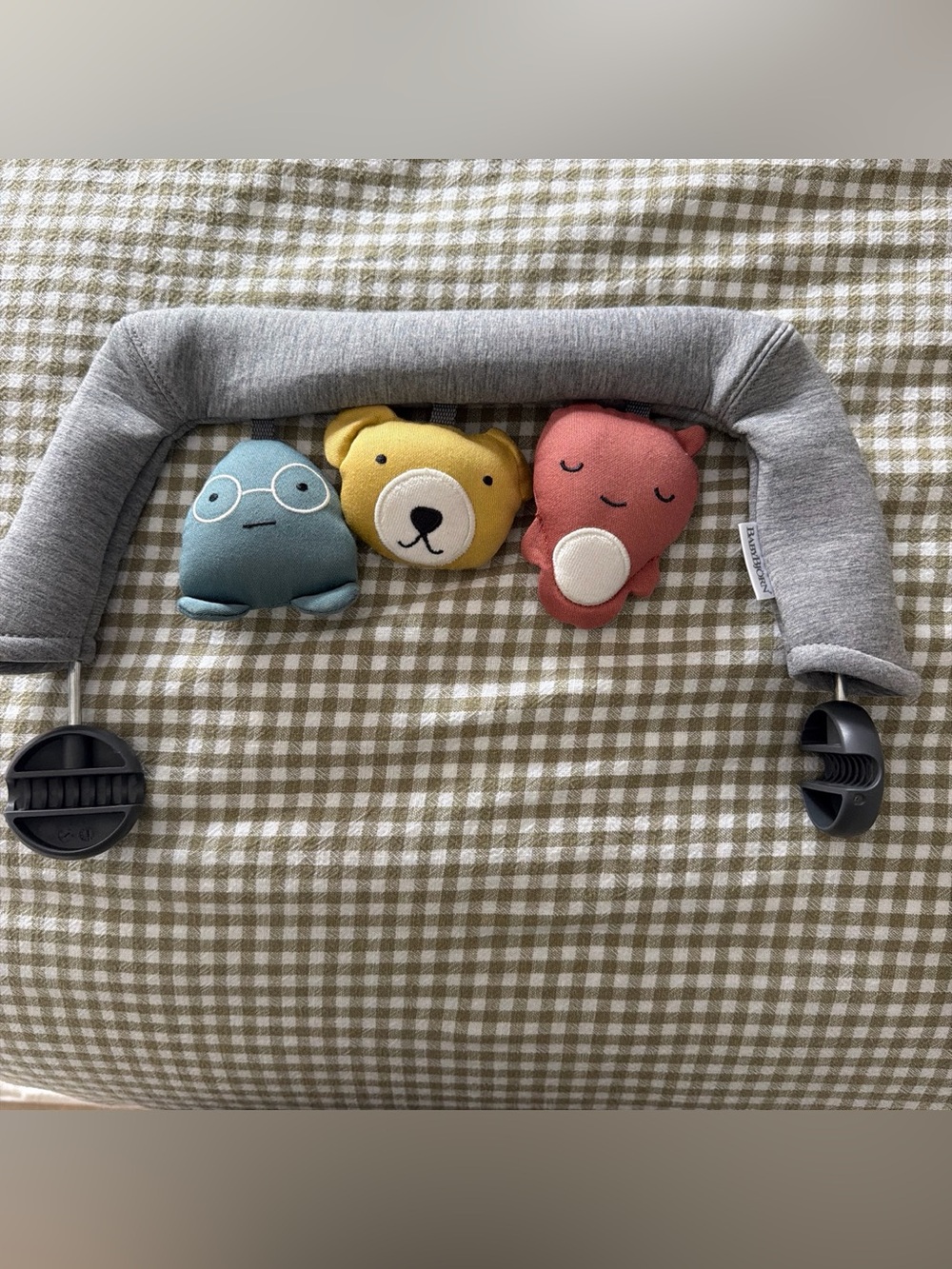 BabyBjorn attachment with three plush rattle toys